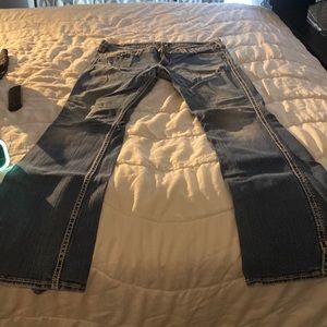 Silver jeans.  Distressed.  Boot cut